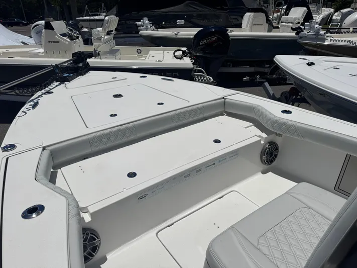  Yacht Photos Pics 2024 Tides 26 boat interior with cushioned seating and modern design.