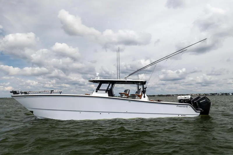  Yacht Photos Pics 2025 Freeman 42 LR boat on water under cloudy sky.