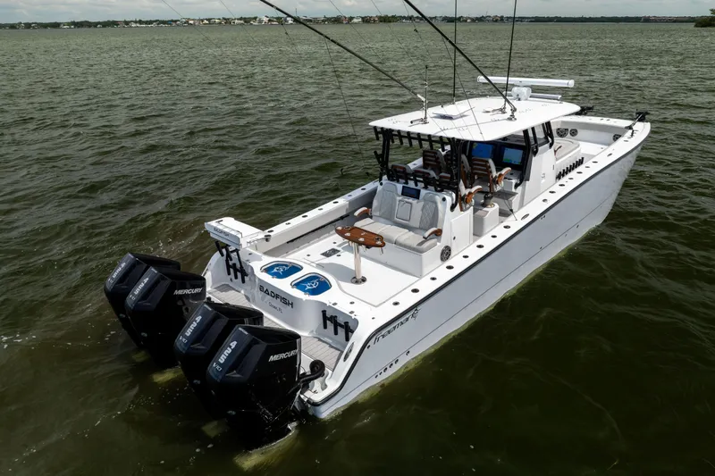  Yacht Photos Pics 2025 Freeman 42 LR boat with multiple outboard engines on open water.