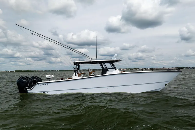  Yacht Photos Pics 2025 Freeman 42 LR boat on water under cloudy sky.