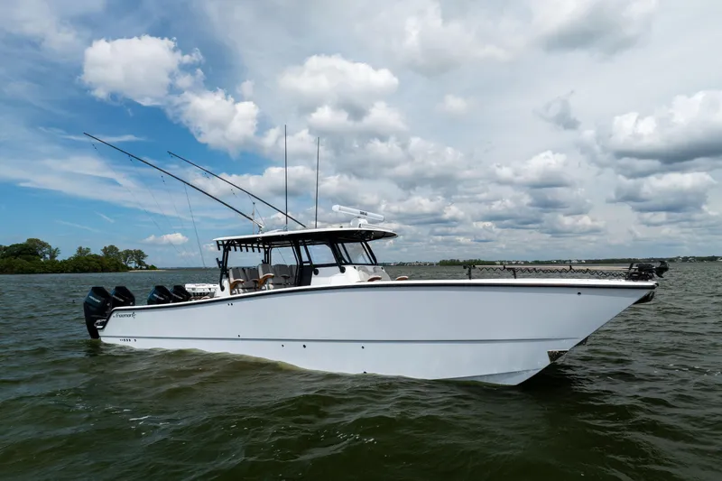  Yacht Photos Pics 2025 Freeman 42 LR boat on water under cloudy sky.