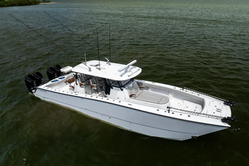  Yacht Photos Pics 2025 Freeman 42 LR boat on water, featuring sleek design and multiple outboard engines.