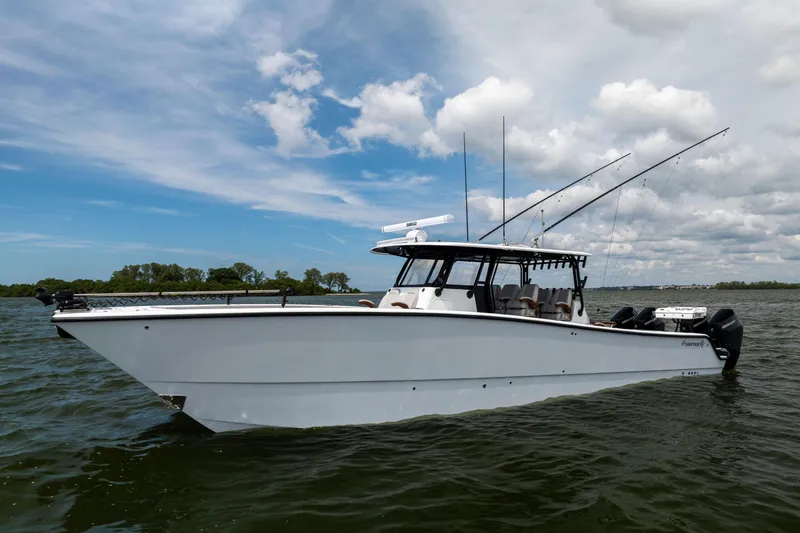  Yacht Photos Pics 2025 Freeman 42 LR boat on water under blue sky with clouds.