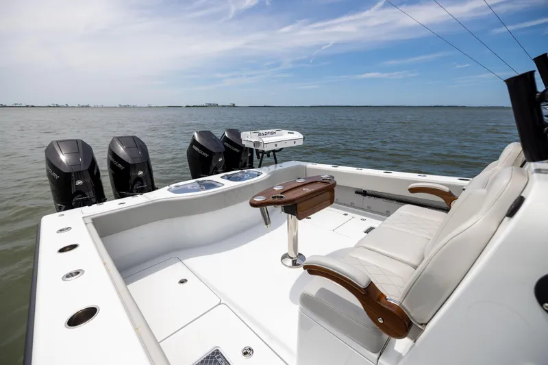  Yacht Photos Pics Luxury Freeman 42 LR boat interior with seating, table, and multiple outboard motors, 2025 model.