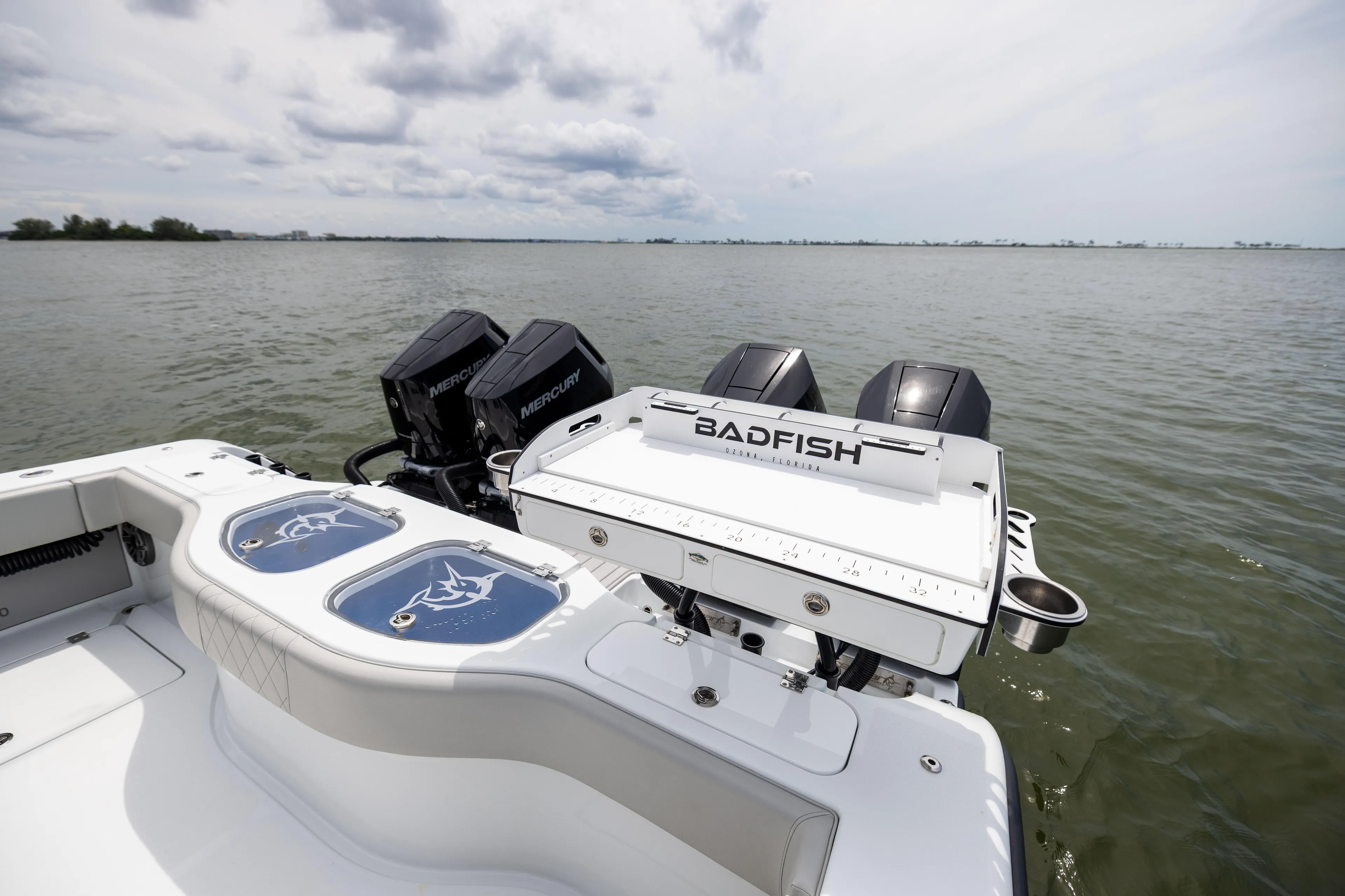  Yacht Photos Pics 2025 Freeman 42 LR boat with Mercury engines on a calm sea.