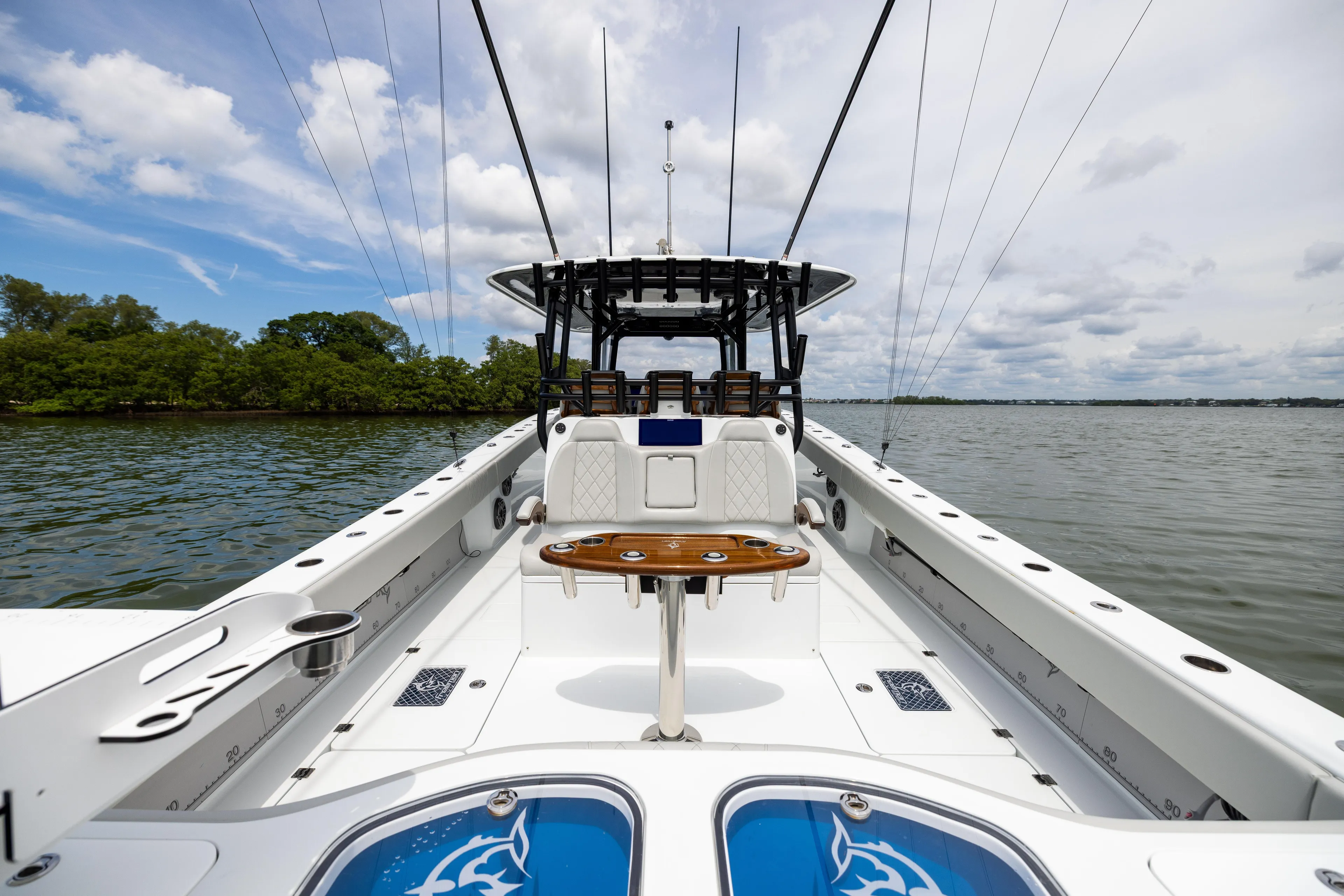  Yacht Photos Pics 2025 Freeman 42 LR boat on calm water, featuring spacious deck and modern design.