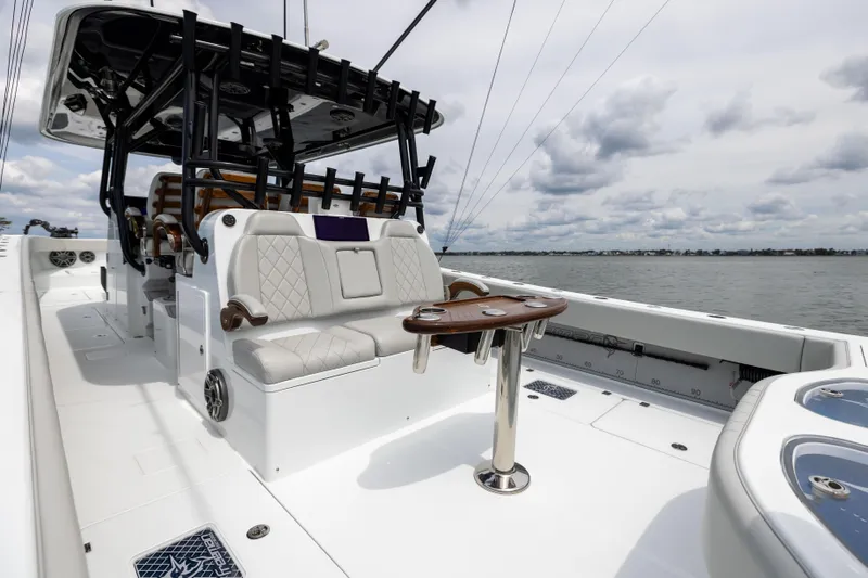  Yacht Photos Pics 2025 Freeman 42 LR boat interior with luxury seating and table on open water.