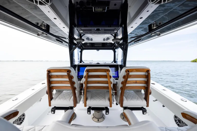  Yacht Photos Pics Luxury interior of 2025 Freeman 42 LR boat with elegant seating and advanced controls.