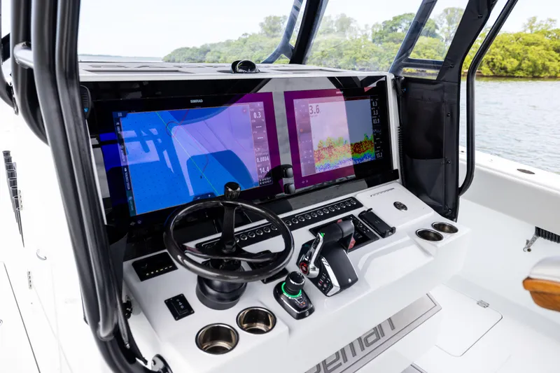  Yacht Photos Pics Cockpit of 2025 Freeman 42 LR boat with advanced navigation system and steering wheel.