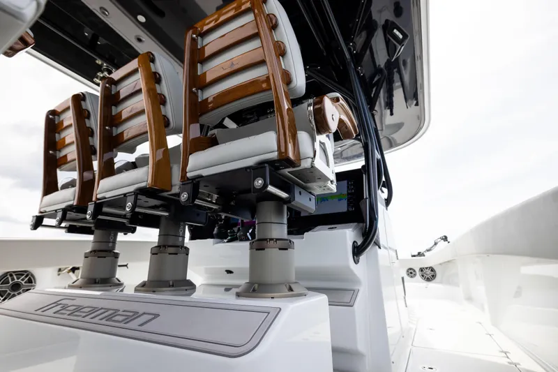  Yacht Photos Pics 2025 Freeman 42 LR boat interior with elegant wooden seating and modern design.