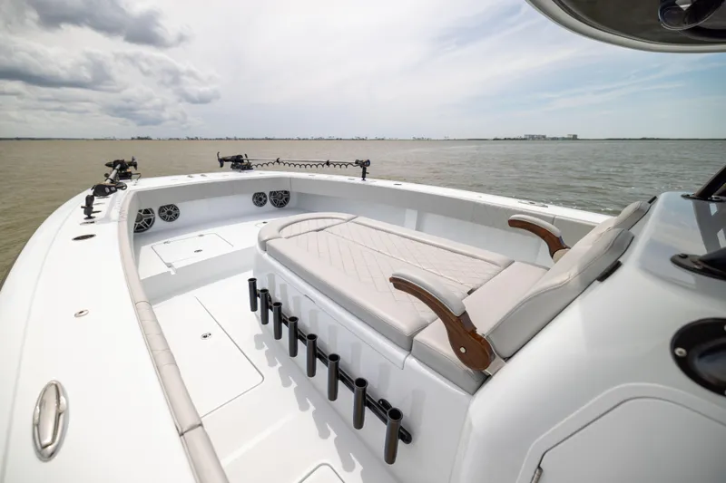  Yacht Photos Pics Luxurious 2025 Freeman 42 LR boat interior with seating, rod holders, and ocean view.