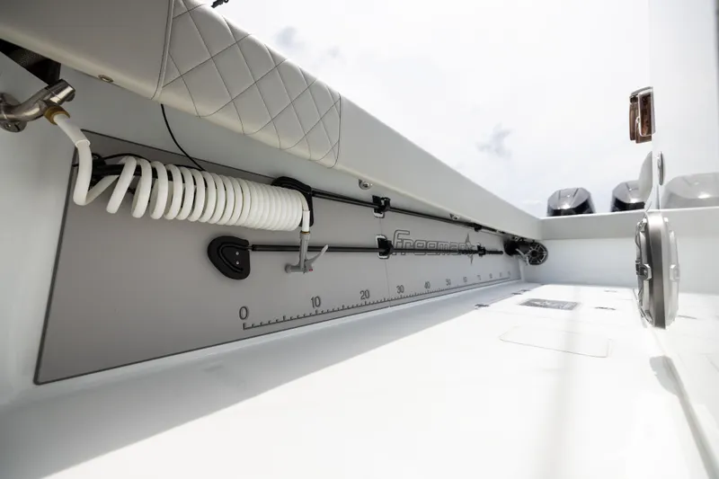  Yacht Photos Pics 2025 Freeman 42 LR boat interior with coiled hose and measurement markings.