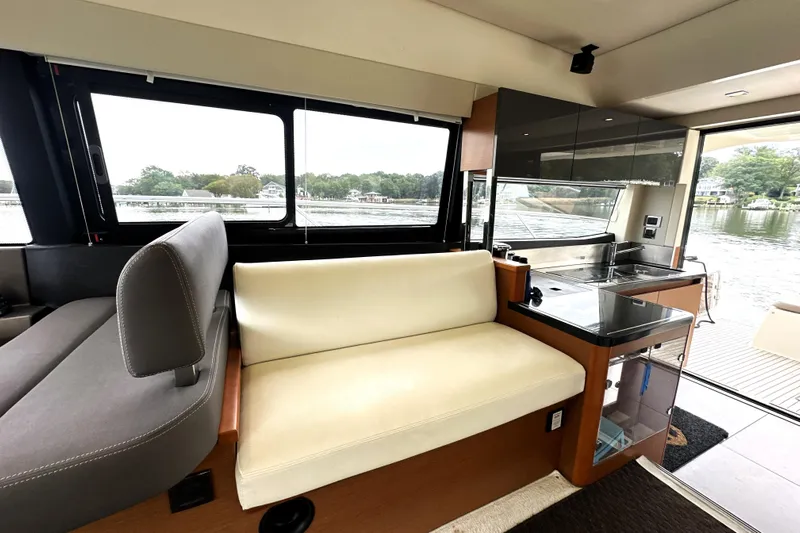 Snusie Q Yacht Photos Pics Luxurious interior of a 2014 Prestige 450 yacht with modern seating and kitchenette.