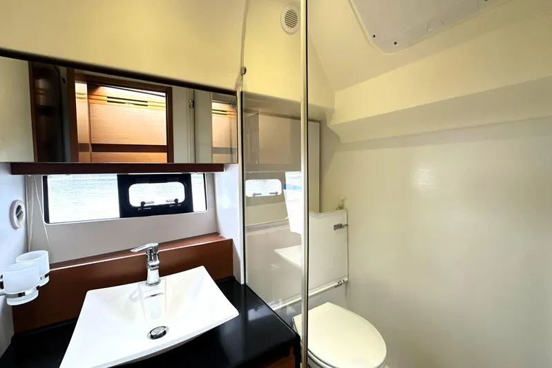 Snusie Q Yacht Photos Pics Luxurious bathroom in 2014 Prestige 450 yacht with modern fixtures and natural light.