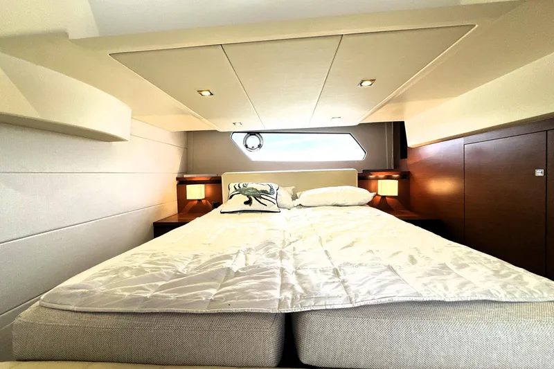 Snusie Q Yacht Photos Pics Luxurious bedroom interior of 2014 Prestige 450 yacht with elegant bedding and ambient lighting.