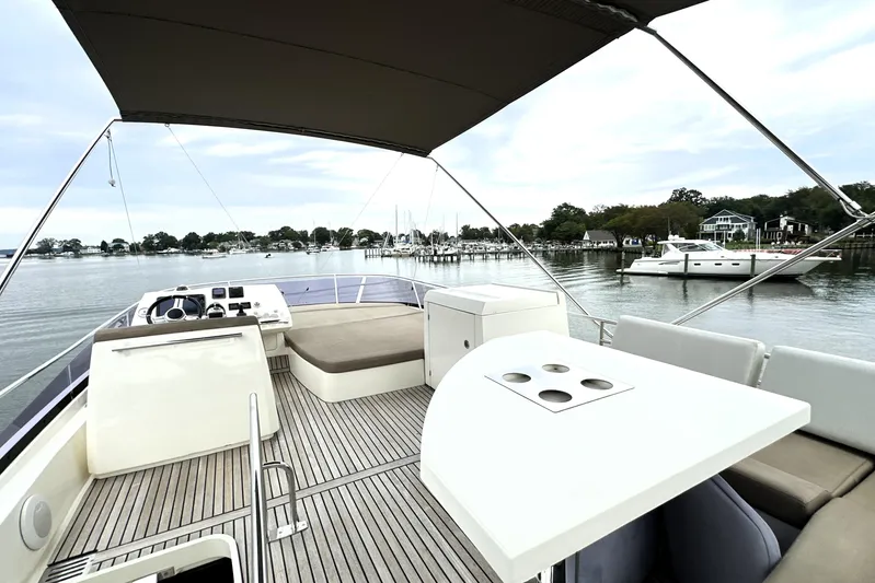 Snusie Q Yacht Photos Pics Luxurious 2014 Prestige 450 yacht with spacious deck, docked in serene marina setting.