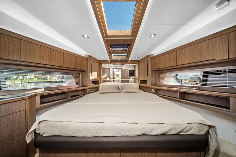  Yacht Photos Pics Luxurious interior of 2019 Galeon 560 Sky yacht with skylight and wood finish.