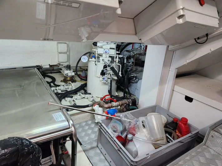  Yacht Photos Pics Engine room of 2019 Riva 100' Corsaro yacht with maintenance tools and equipment.