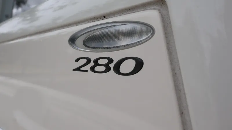  Yacht Photos Pics Close-up of 2023 Cobia 280 Center Console boat emblem.