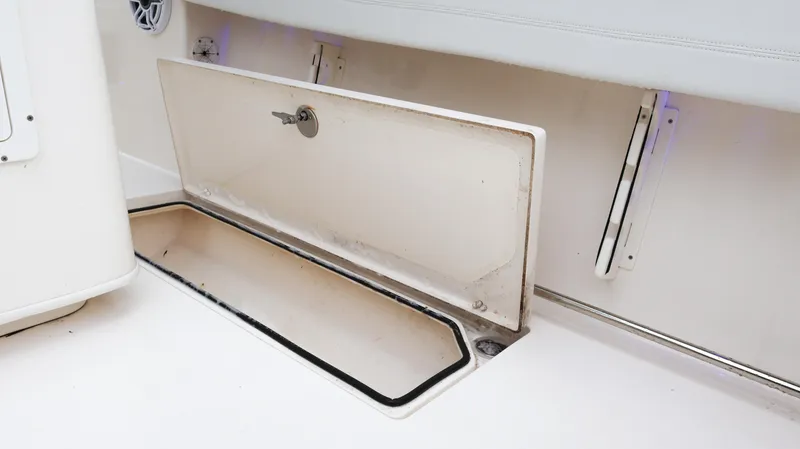  Yacht Photos Pics Open storage compartment on 2023 Cobia 280 Center Console boat.
