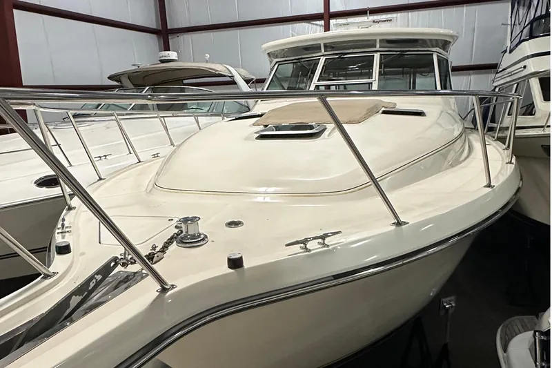 R Gang Yacht Photos Pics 1997 Tiara Yachts 4000 Express in storage, showcasing sleek design and polished railings.