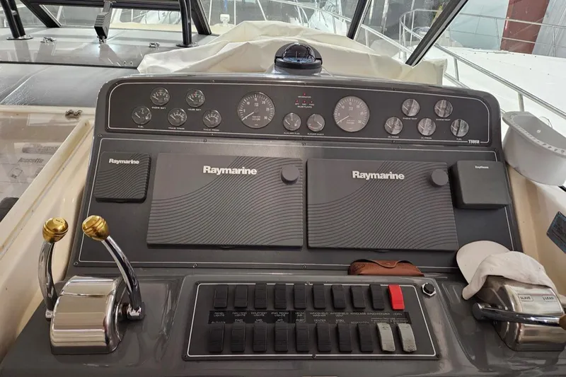 R Gang Yacht Photos Pics 1997 Tiara Yachts 4000 Express dashboard with Raymarine navigation equipment and control panel.