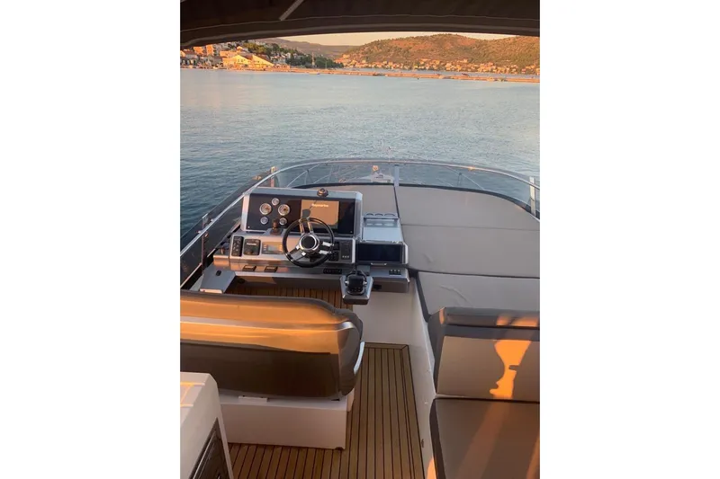  Yacht Photos Pics Flybridge of 2014 Galeon 550 Fly yacht with scenic coastal view.