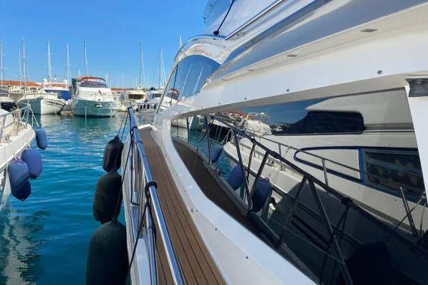  Yacht Photos Pics Galeon 550 Fly 2014 yacht docked in a marina with other boats.