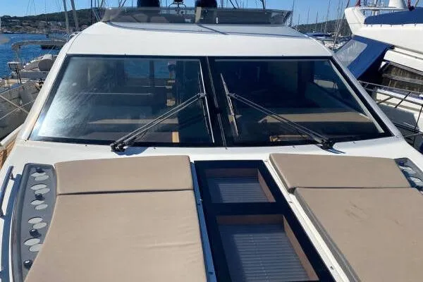  Yacht Photos Pics 2014 Galeon 550 Fly yacht with sunbathing deck and sleek design in marina.