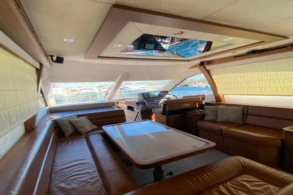  Yacht Photos Pics Luxurious interior of 2014 Galeon 550 Fly yacht with leather seating and panoramic windows.