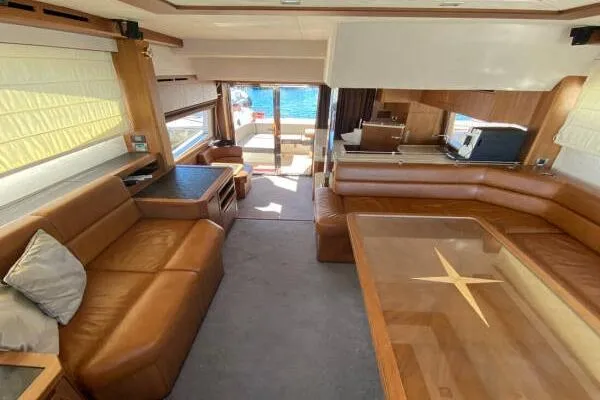  Yacht Photos Pics Luxurious interior of 2014 Galeon 550 Fly yacht with leather seating and elegant wood finishes.