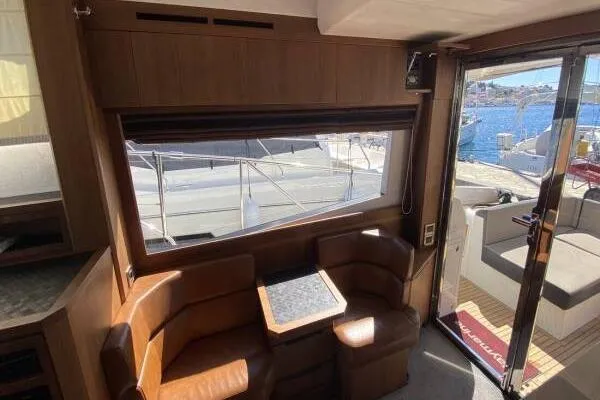  Yacht Photos Pics Interior of 2014 Galeon 550 Fly yacht with leather seating and marina view.