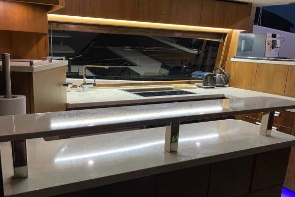  Yacht Photos Pics Luxurious kitchen interior of 2014 Galeon 550 Fly yacht with modern amenities.