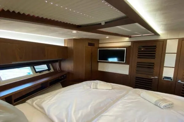  Yacht Photos Pics Luxurious bedroom interior of 2014 Galeon 550 Fly yacht with modern amenities.