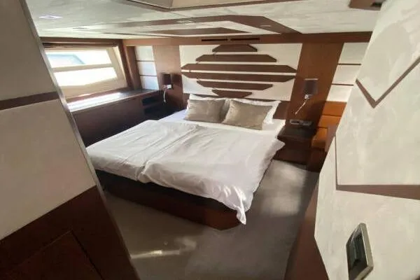  Yacht Photos Pics Luxurious bedroom interior of 2014 Galeon 550 Fly yacht with modern design and cozy bedding.