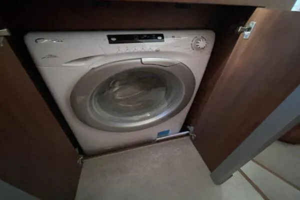  Yacht Photos Pics Washing machine inside a 2014 Galeon 550 Fly yacht's wooden cabinet.