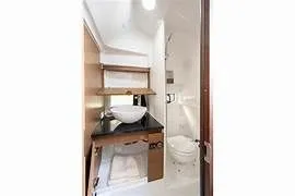  Yacht Photos Pics Interior of 2023 Beneteau Flyer 9 SUNdeck with sink and toilet.