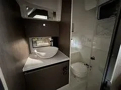  Yacht Photos Pics Interior of 2023 Beneteau Flyer 9 SUNdeck with sink and toilet.