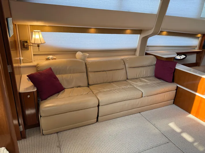 Jamm Yacht Photos Pics Luxurious interior of 2005 Meridian 459 Motoryacht with beige leather sofa and elegant decor.