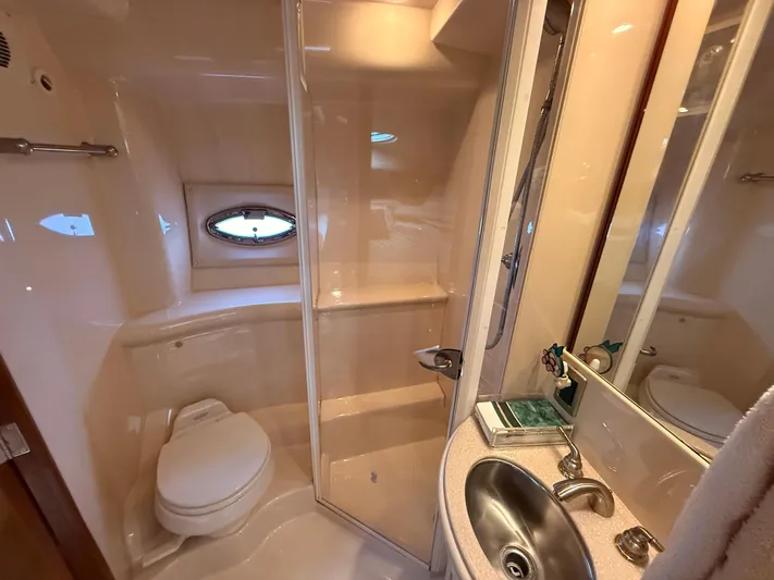 Jamm Yacht Photos Pics Bathroom interior of 2005 Meridian 459 Motoryacht with shower, sink, and toilet.
