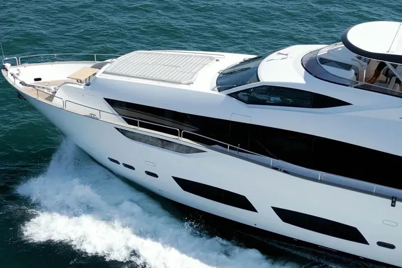  Yacht Photos Pics Luxurious 2018 Sunseeker 95 yacht cruising on open water.