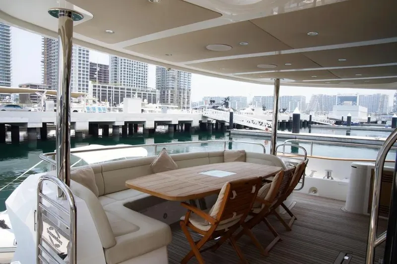  Yacht Photos Pics Luxurious 2018 Sunseeker 95 yacht deck with elegant seating and marina view.
