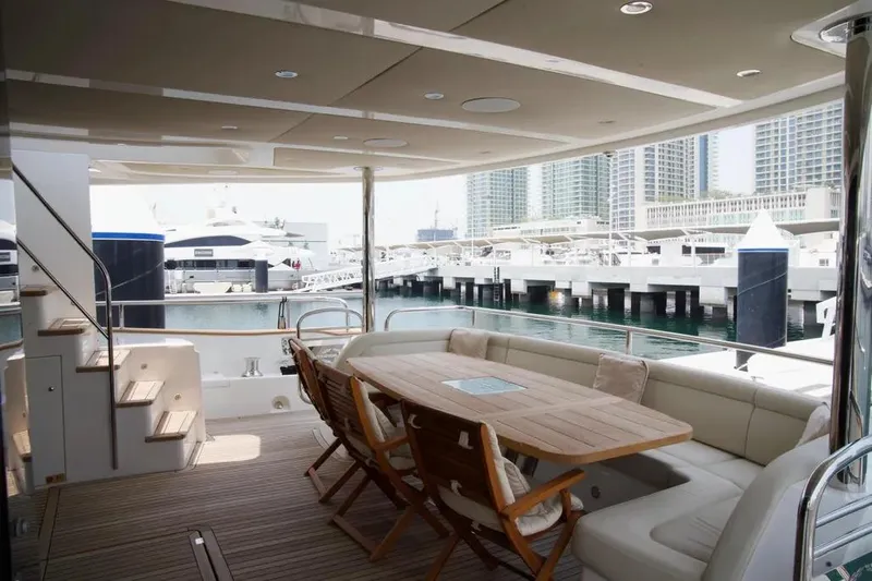  Yacht Photos Pics Luxurious 2018 Sunseeker 95 yacht deck with seating and marina view.