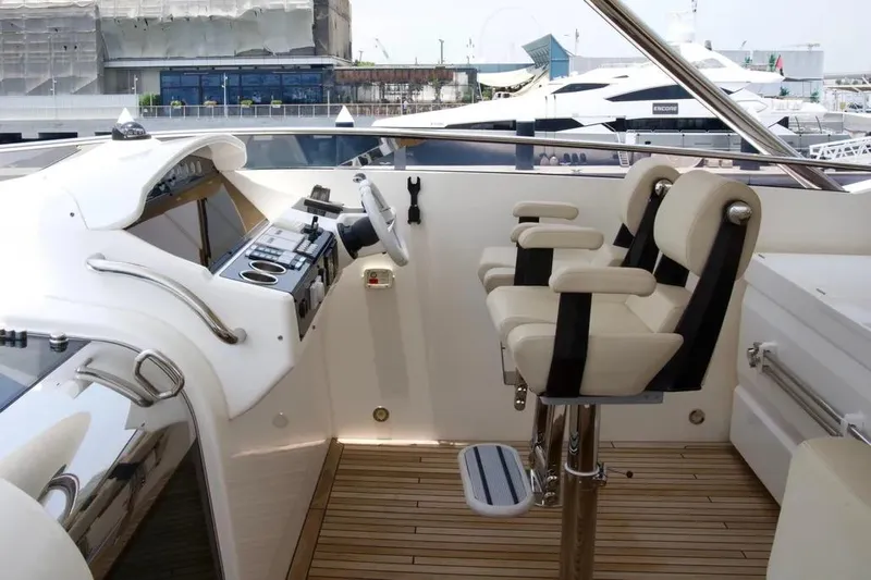  Yacht Photos Pics Luxurious 2018 Sunseeker 95 yacht helm with dual seats and modern controls.