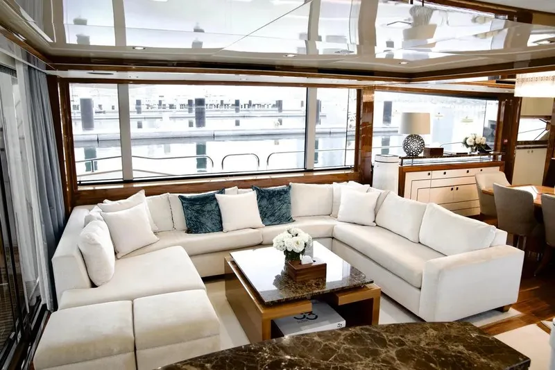  Yacht Photos Pics Luxurious interior of 2018 Sunseeker 95 yacht with elegant white sectional sofa.