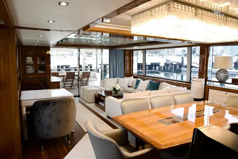  Yacht Photos Pics Luxurious interior of a 2018 Sunseeker 95 yacht with elegant dining and seating areas.