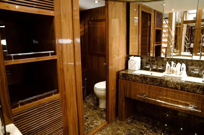  Yacht Photos Pics Luxurious bathroom on 2018 Sunseeker 95 yacht with elegant wood and marble finishes.