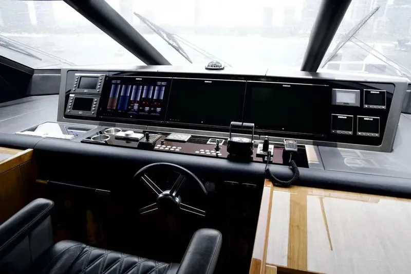  Yacht Photos Pics Control panel of a 2018 Sunseeker 95 yacht, featuring advanced navigation systems.