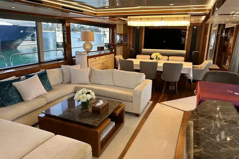  Yacht Photos Pics Luxurious interior of 2018 Sunseeker 95 yacht with elegant seating and dining area.