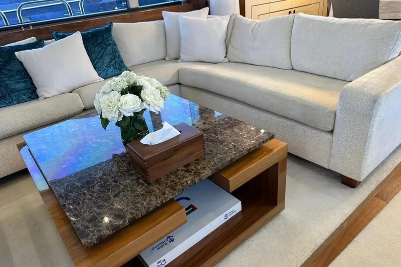  Yacht Photos Pics Luxurious Sunseeker 95 yacht interior with elegant sofa and marble coffee table, 2018 model.